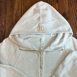 Lululemon Athletica Heather grey/cream Hoodie with Gold trim great condition M/L